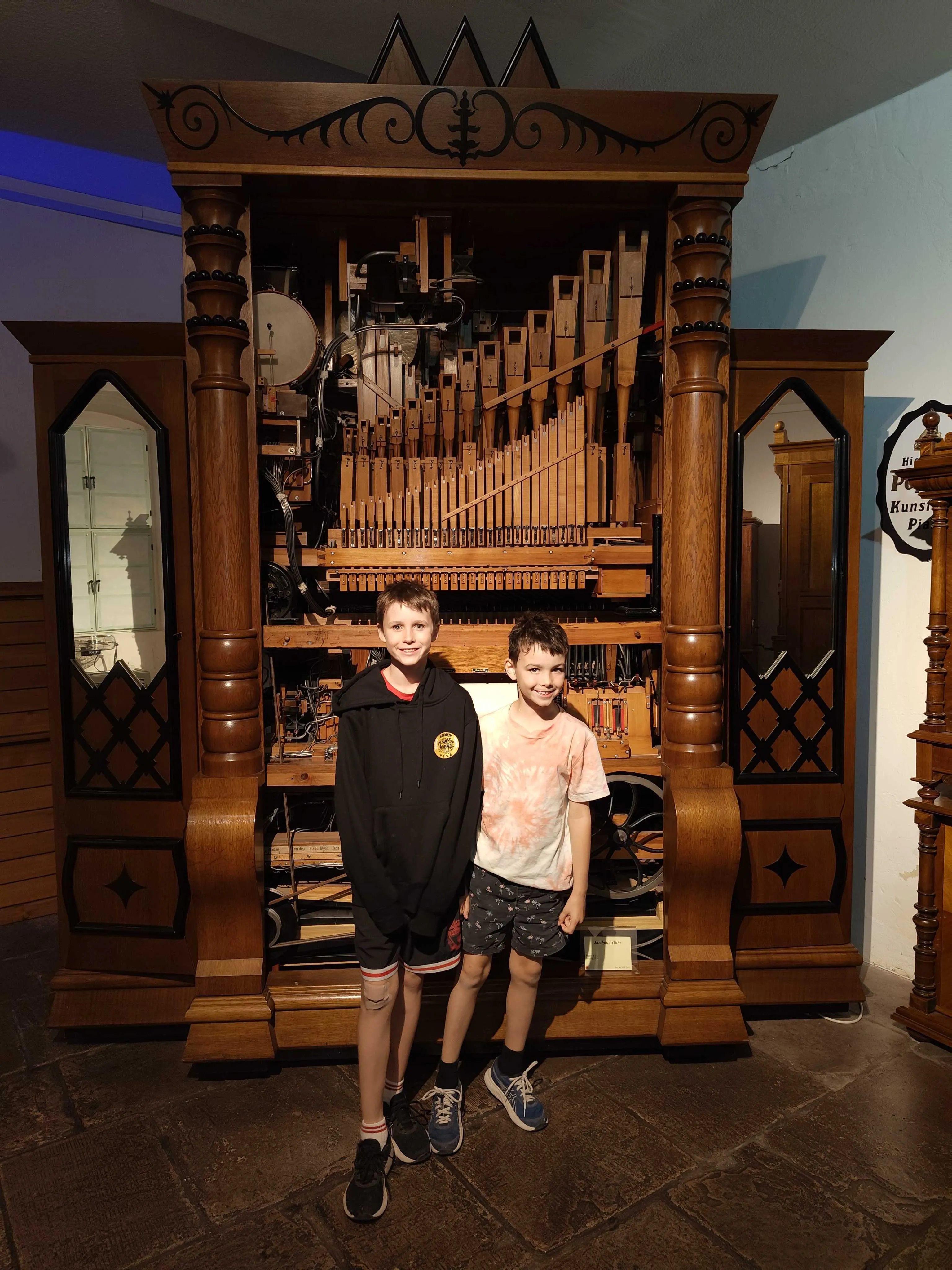 Jake and Miles in front of one of the many automatic organs