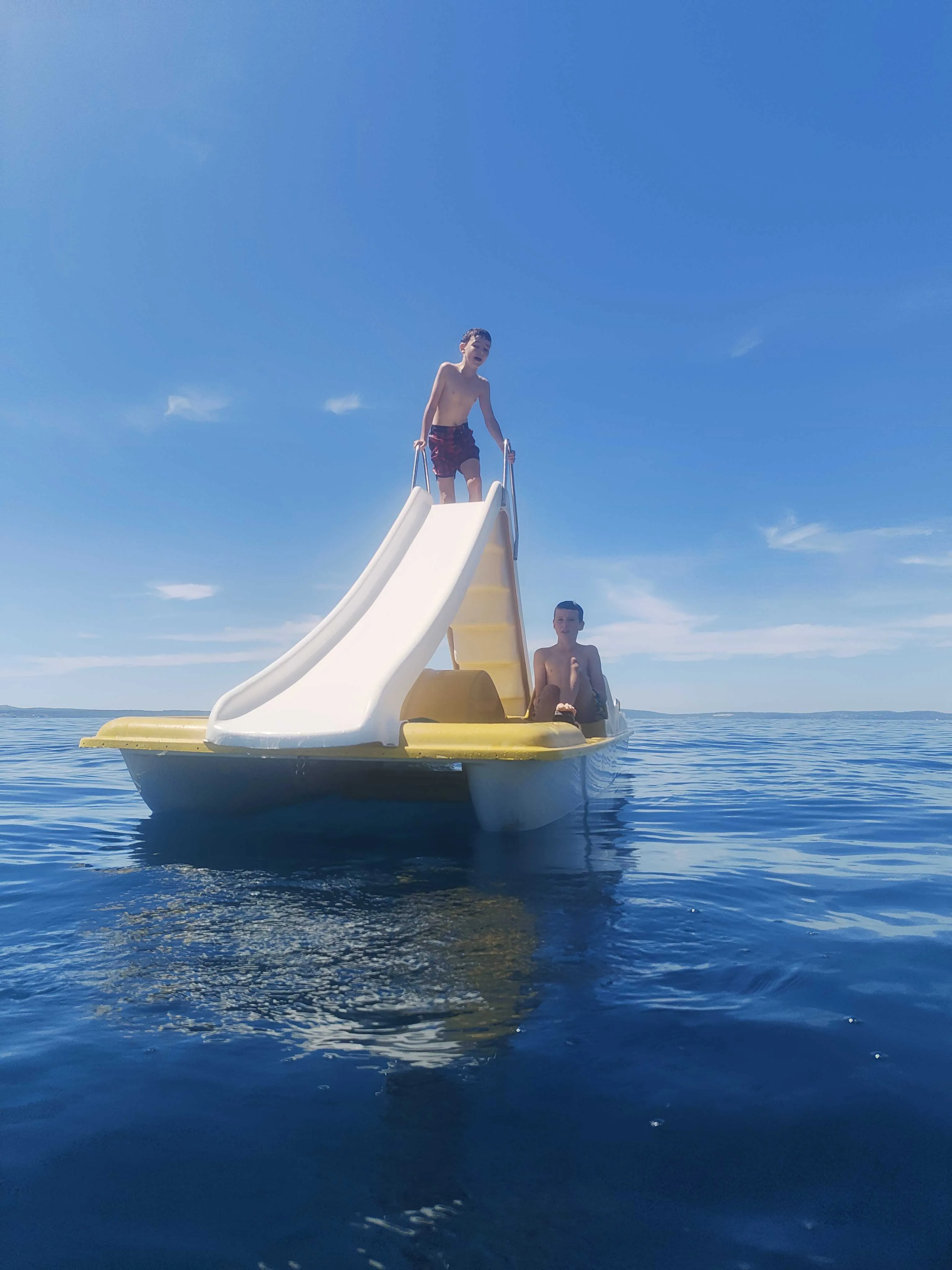 Miles and Jake on the pedalo
