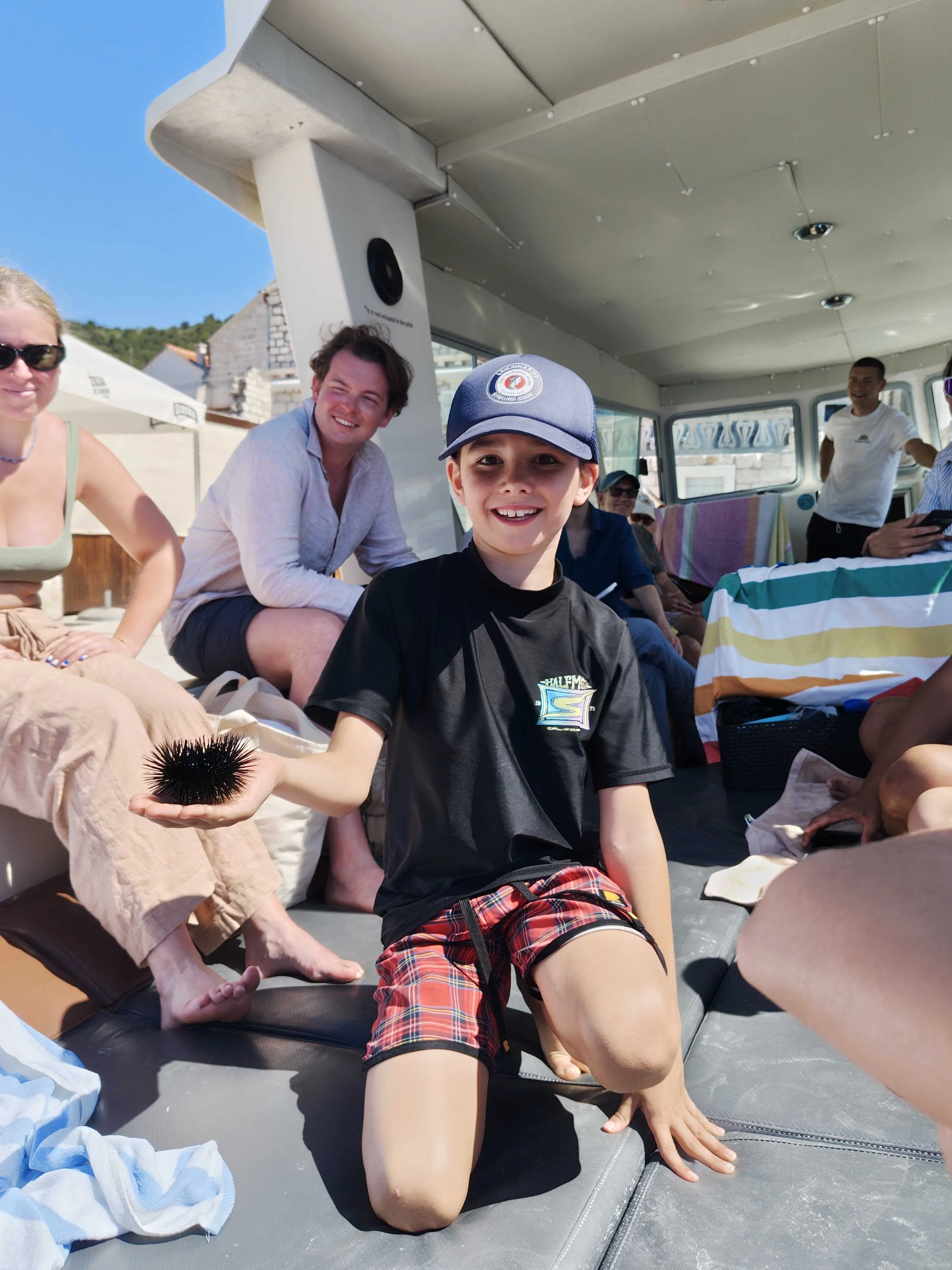 Miles holding a sea urchin
