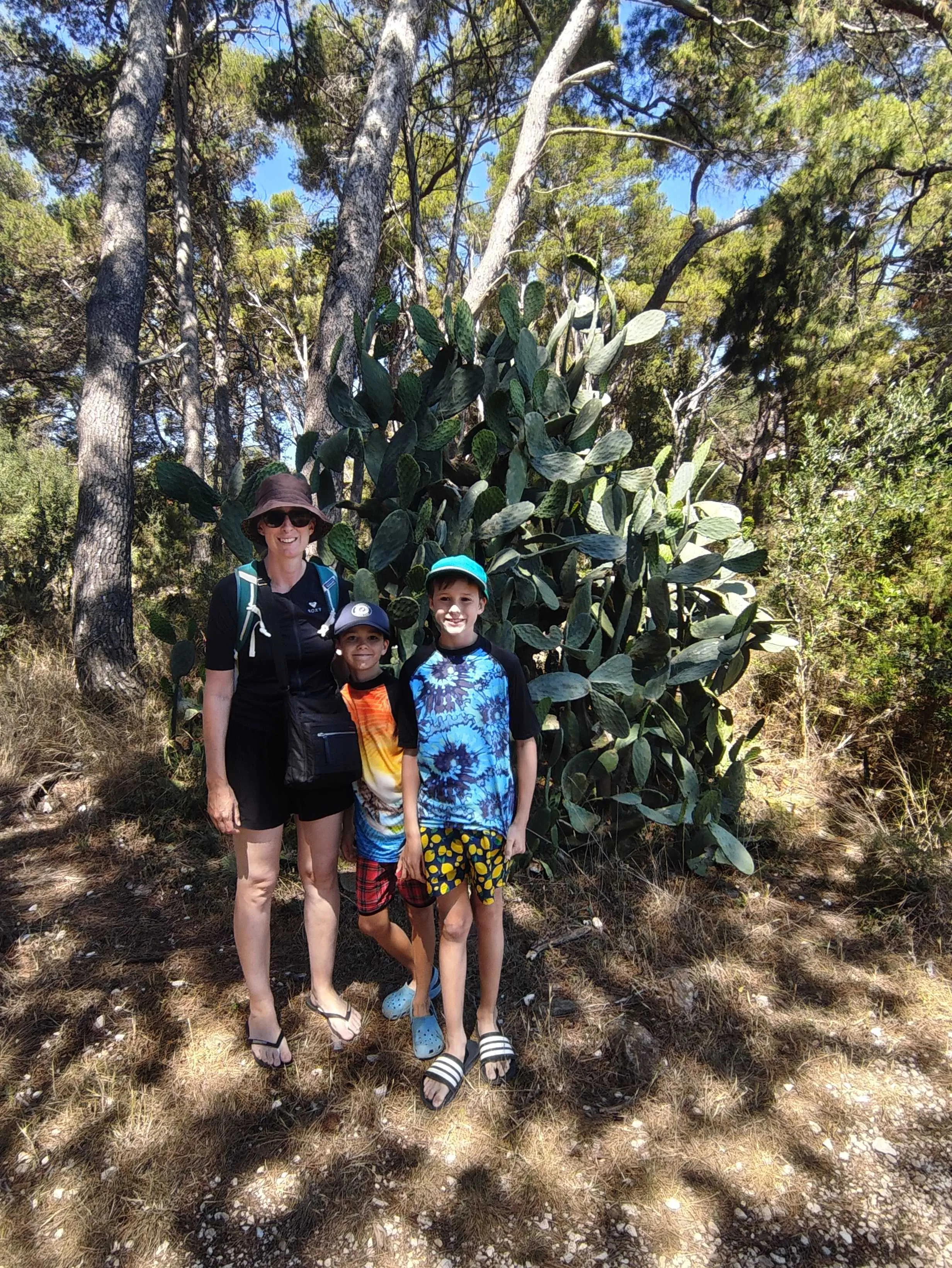 Sonia, Miles and Jake checking out a cactus