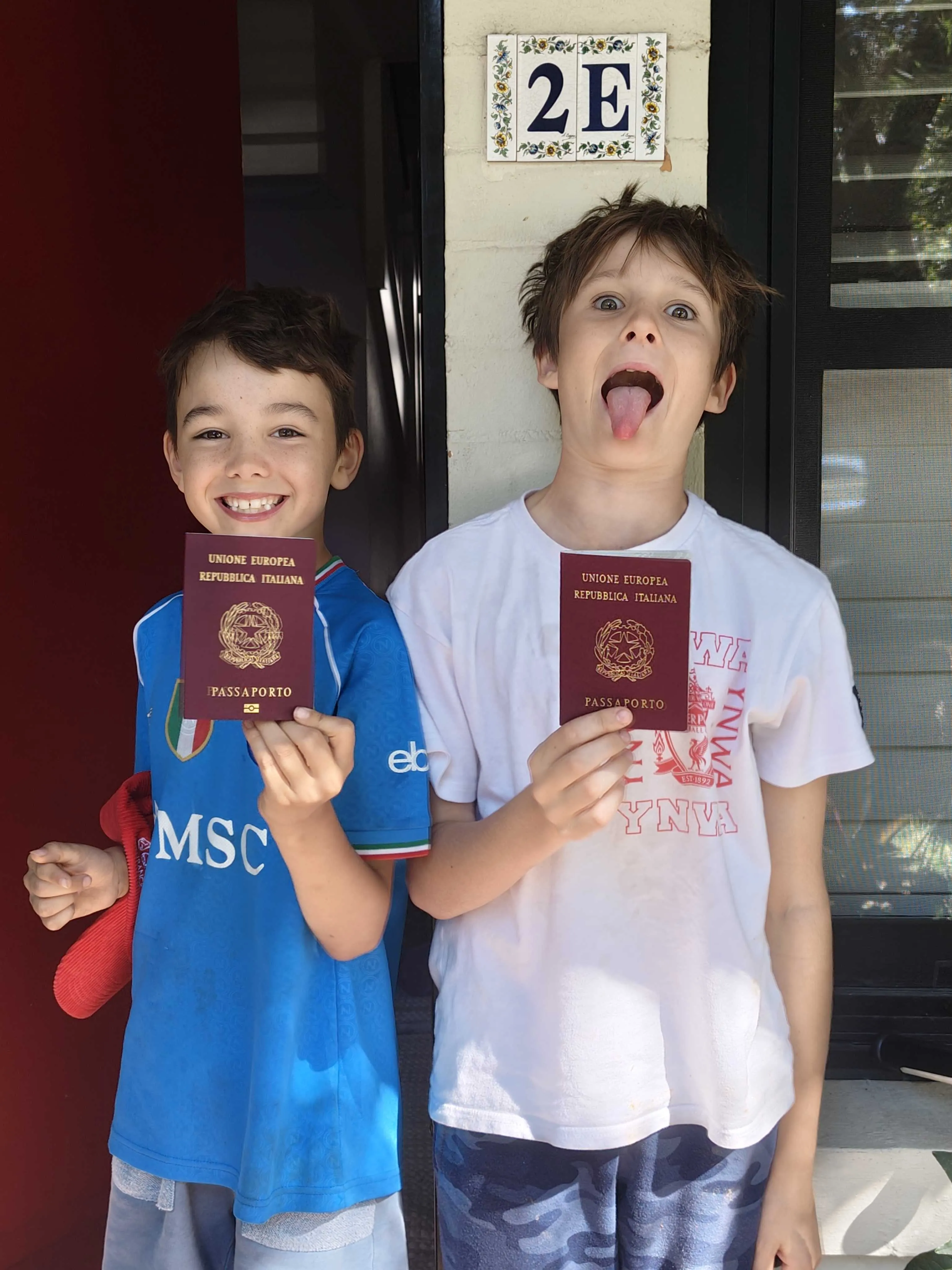 Jake and Miles proudly displaying their Italian passports